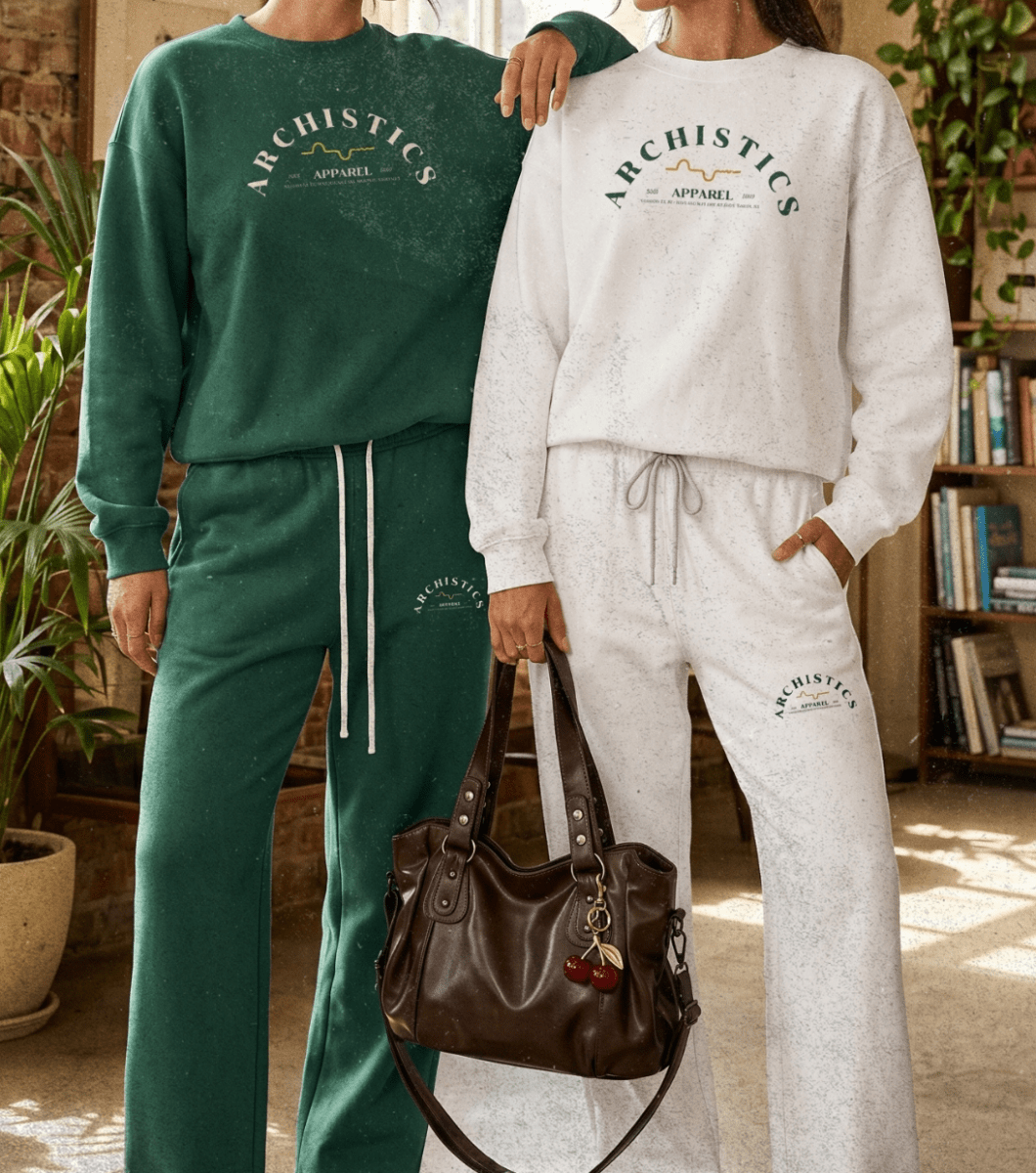 Two women wearing matching green and white sweatsuits with 'Archistics' branding in a room with plants and books.